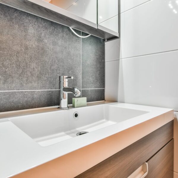 50650470 a bathroom with a sink and a mirror