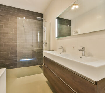 50725890 a bathroom with a white sink and a shower 360x320