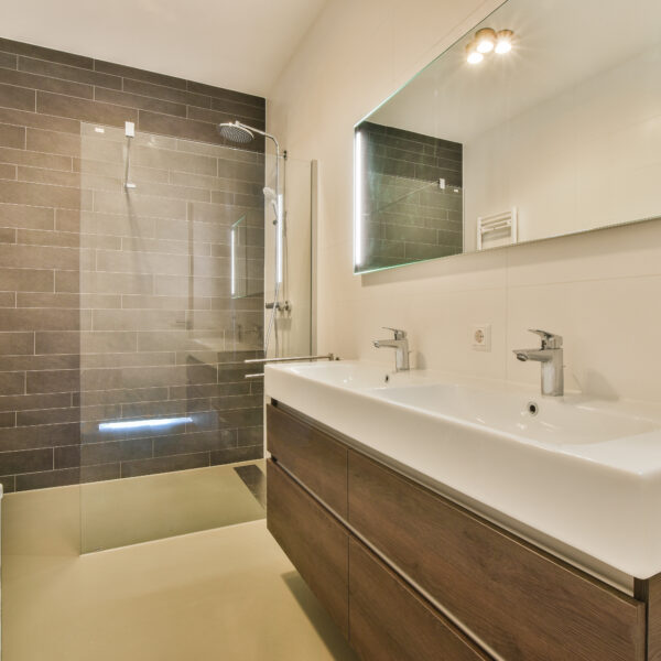 50725890 a bathroom with a white sink and a shower 600x600